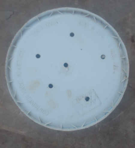 holes drilled in the bottom of the bucket