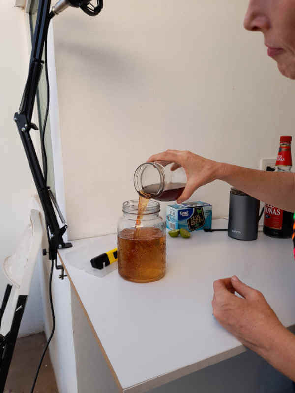 pouring tea mix into distilled water