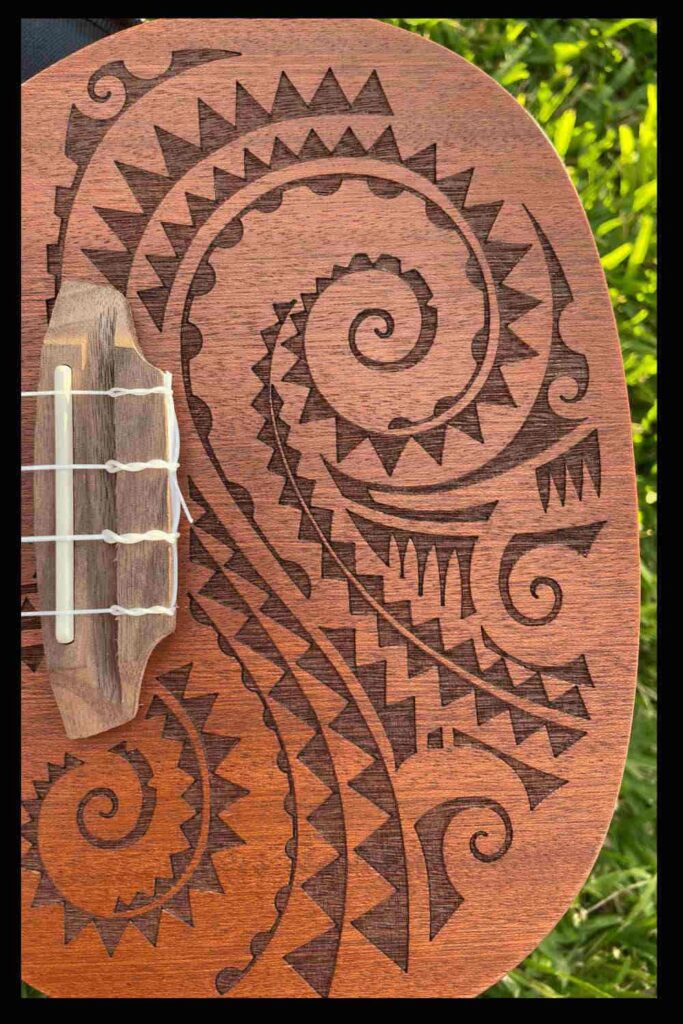 Luna Tattoo ukulele carving design